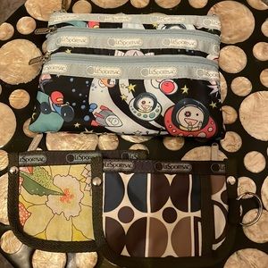 LeSportsac three zip pouch and two key holders.